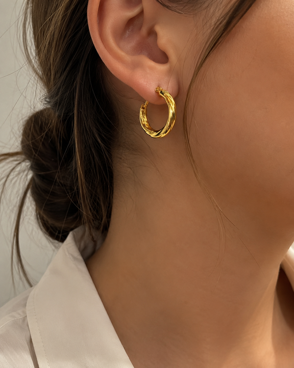 Ms Allure Spiral Out Control Earrings — gold-tone stainless steel earrings with an elegant, feminine finish.