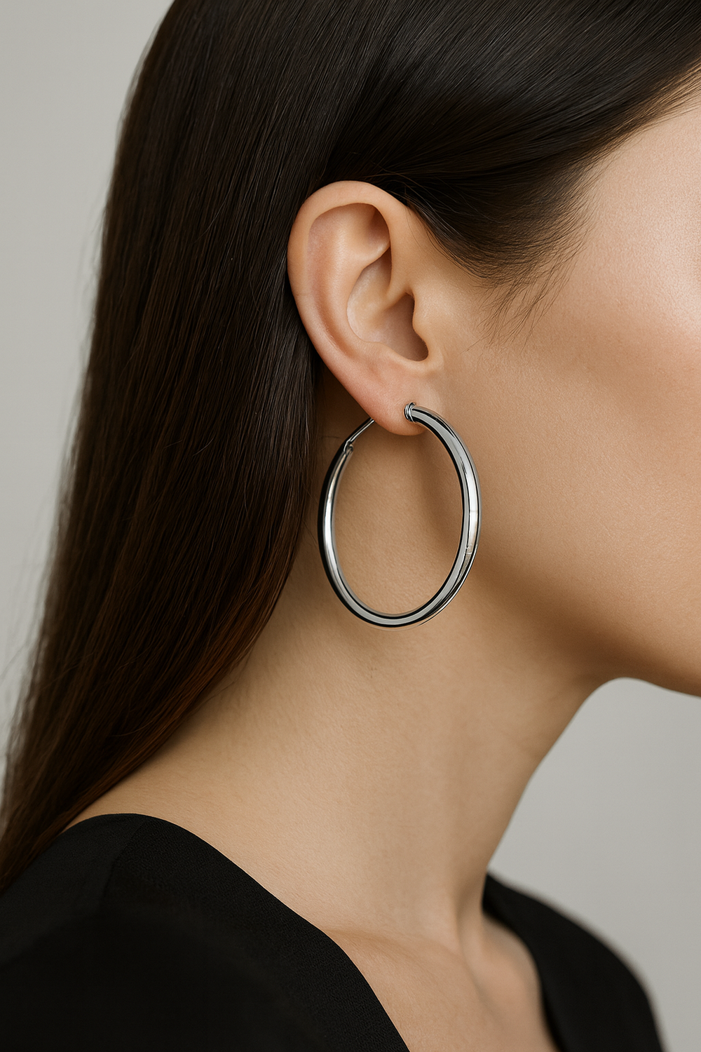 Ms Allure Unbreakable Earrings — gold-tone stainless steel hoop earrings with an elegant, feminine finish.